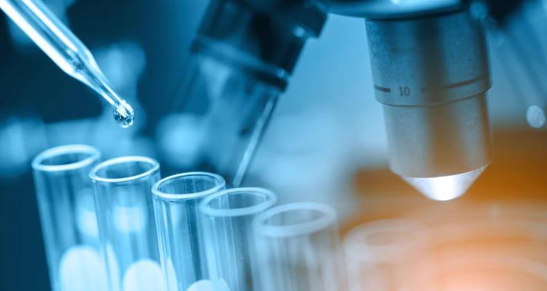 Microscope with lab glassware