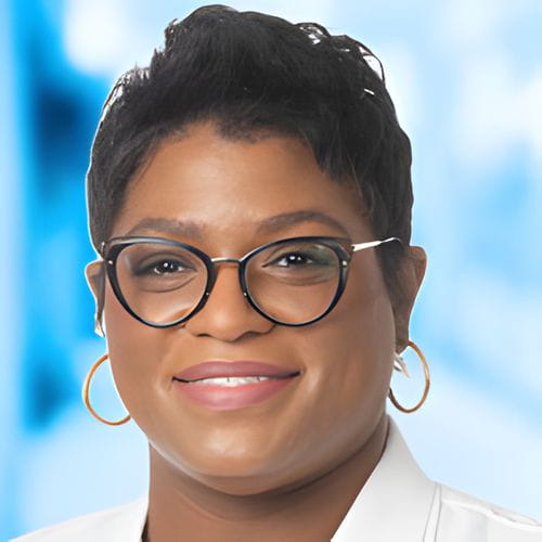 Headshot of Dr Adams on white and blue background