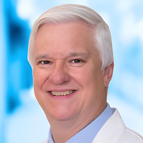 Headshot of Dr Kemberling on white and blue background