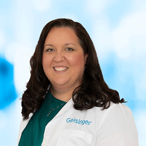 Headshot of Dr Holencik on white and blue background