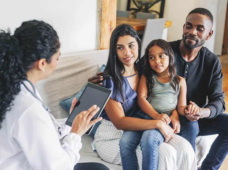 A primary care doctor talking to a family