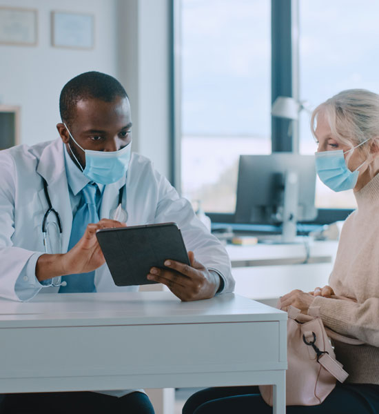 an image of a doctor talking with a patient